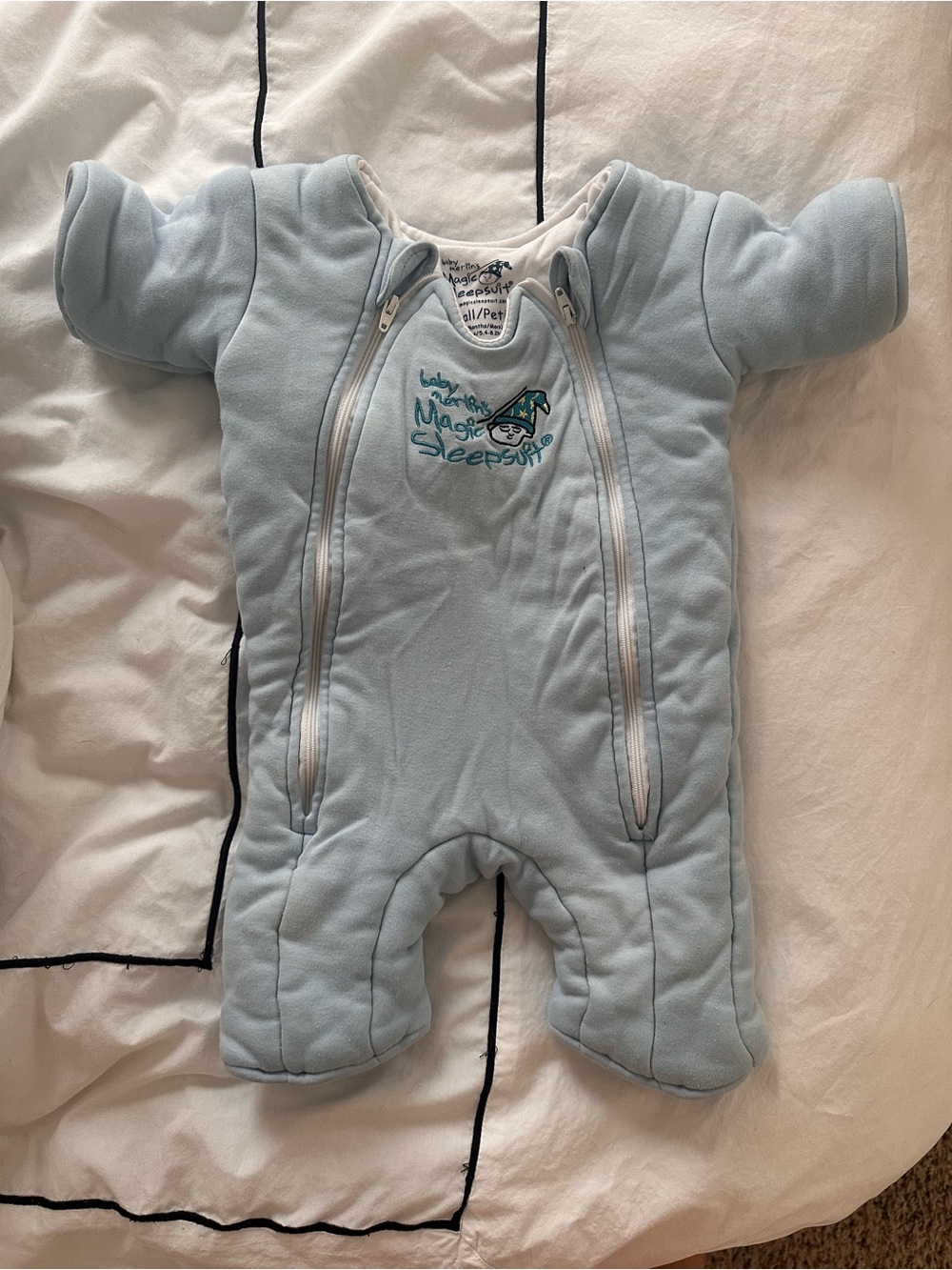 Baby Merlin’s Light Blue Magic Sleepsuit